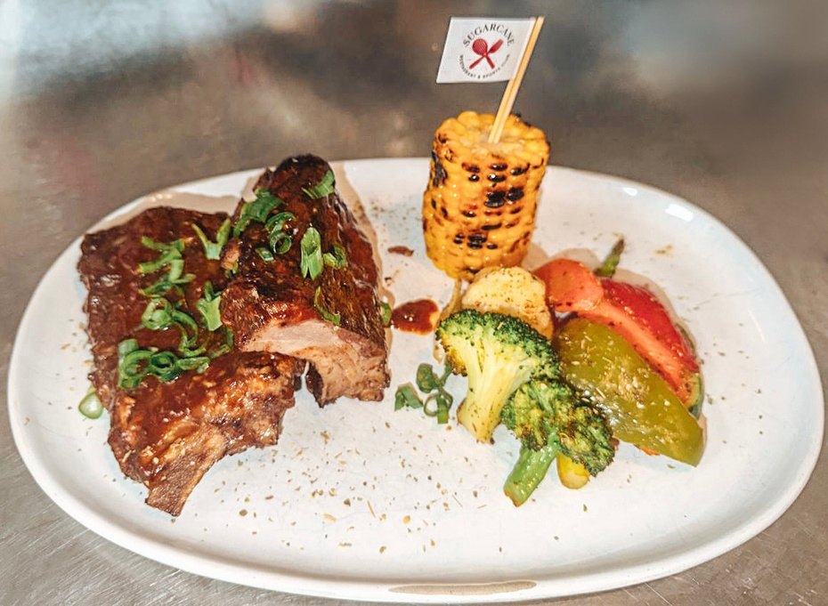 Honey Ginger BBQ Pork Ribs with roasted corn and sauteed vegetables